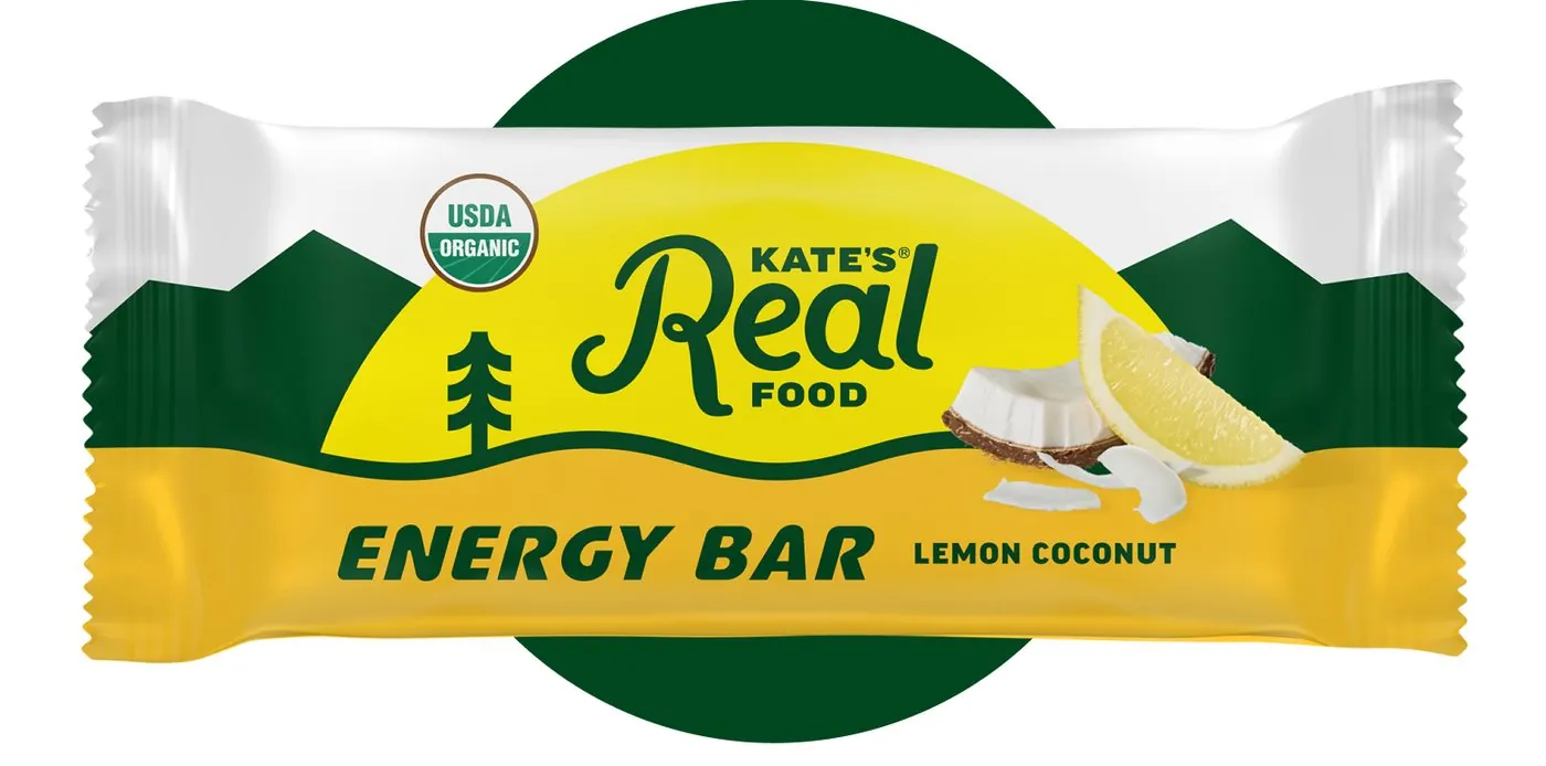 A Kate's Real Food Lemon Coconut energy bar in its yellow and green wrapper